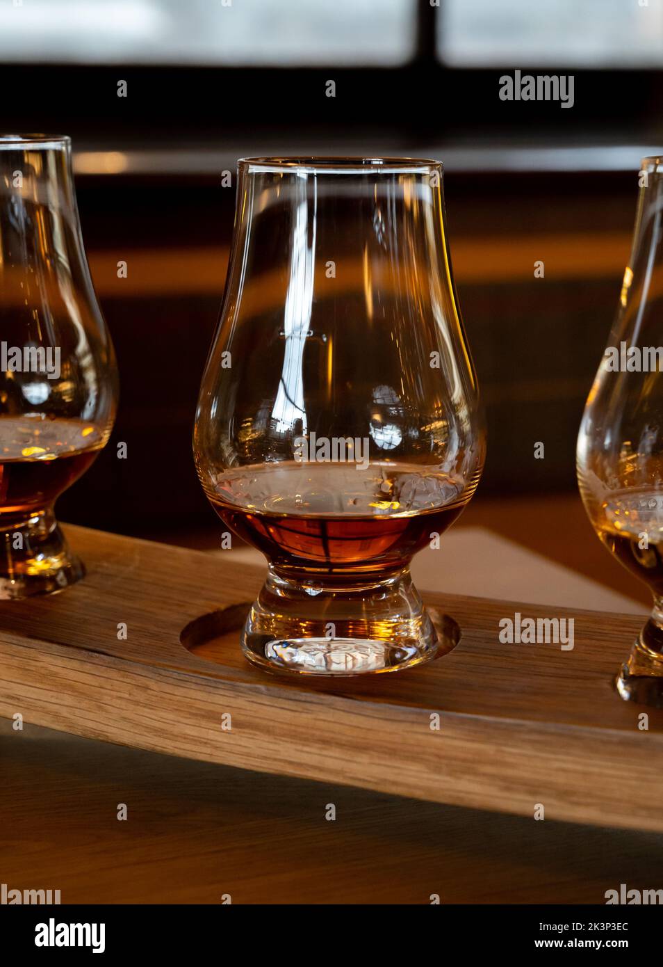 Flight of single malt scotch whisky in glasses served in bar in ...