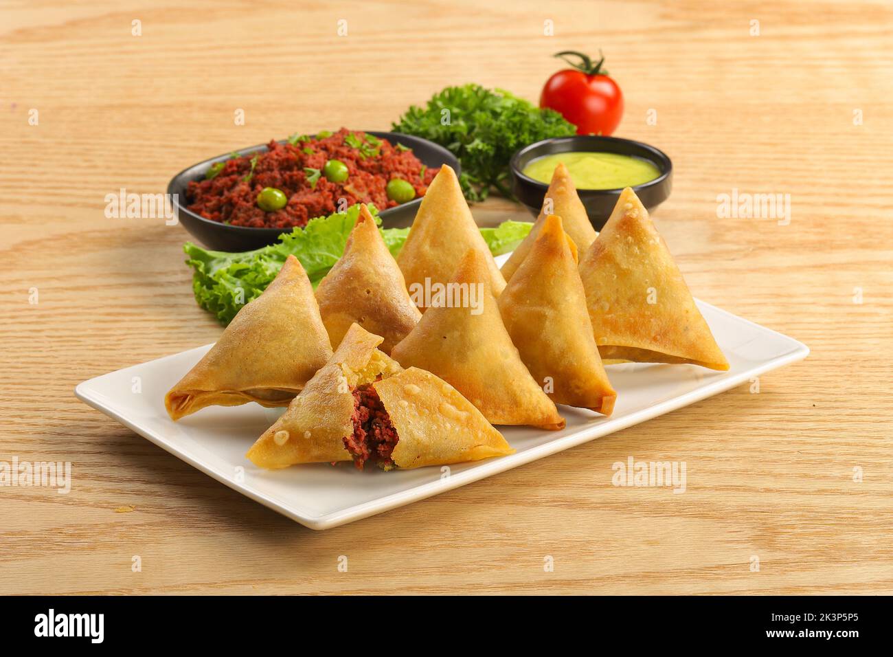 indian street food singara, samosha on plate,detail shot of a indian food singara on plate Stock Photo