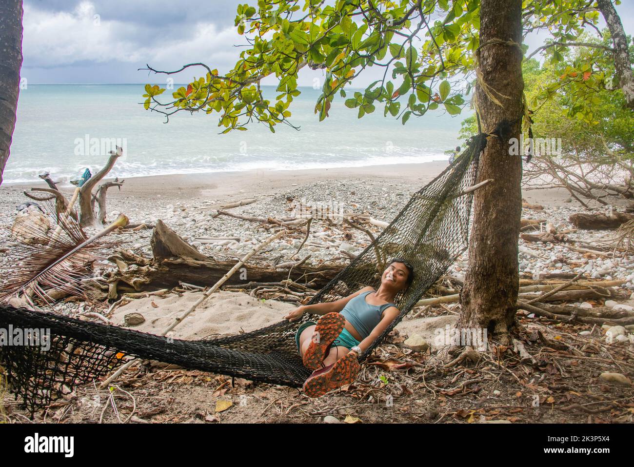 Enjoying a wild beach at the edge of Cabo Blanco Nature Reserve, Costa Rica Stock Photo