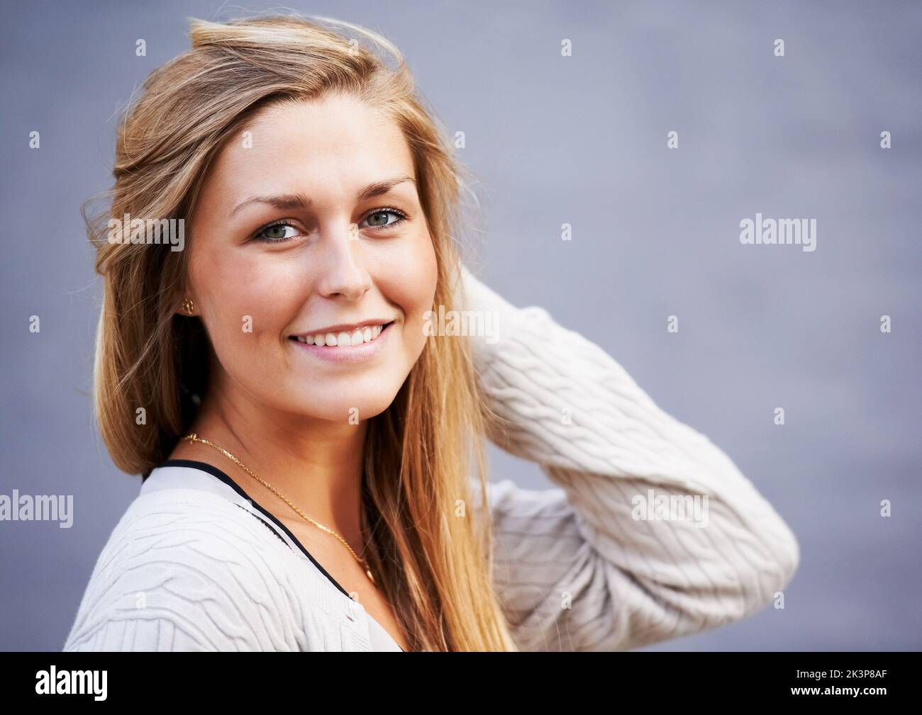 Flashing a candid smile. Portrait of beautiful young woman posing