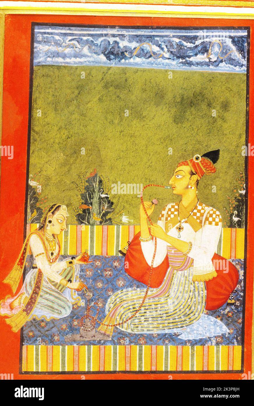 India: Basohli, Circa 1685, Raja Medini Pal smoking hookah Stock Photo