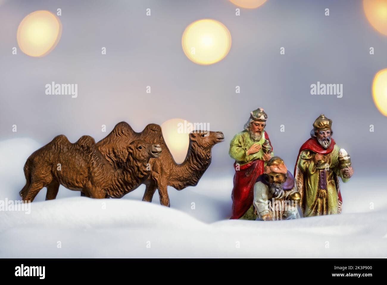 antique figures of the three kings with two camels, christmas picture Stock Photo