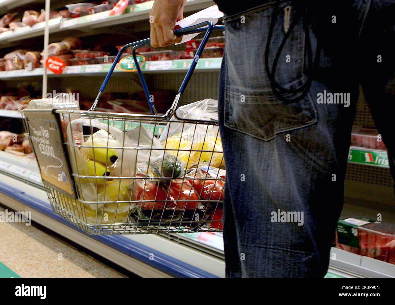 Undated file photo of a person holding a shopping basket in a supermarket, as food inflation has hit its highest rate on record, with shoppers now paying 10.6% more than they were a year ago, figures show. Stock Photo