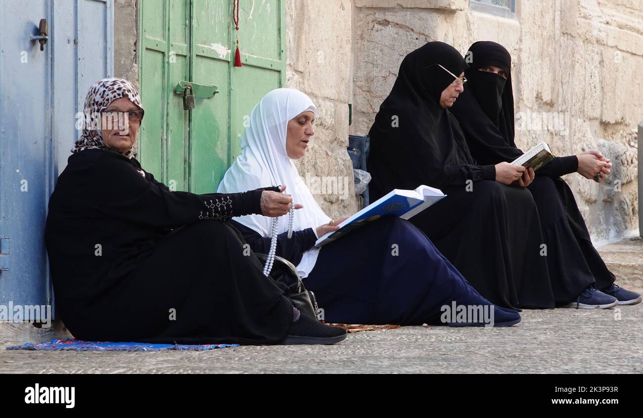 Palestinian woman read the Quran in the old city of Jerusalem Israel Stock Photo