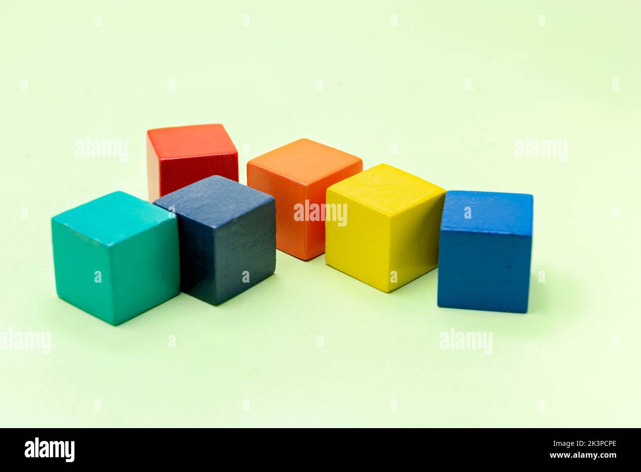 Colorful wooden block toys on a colored background Stock Photo