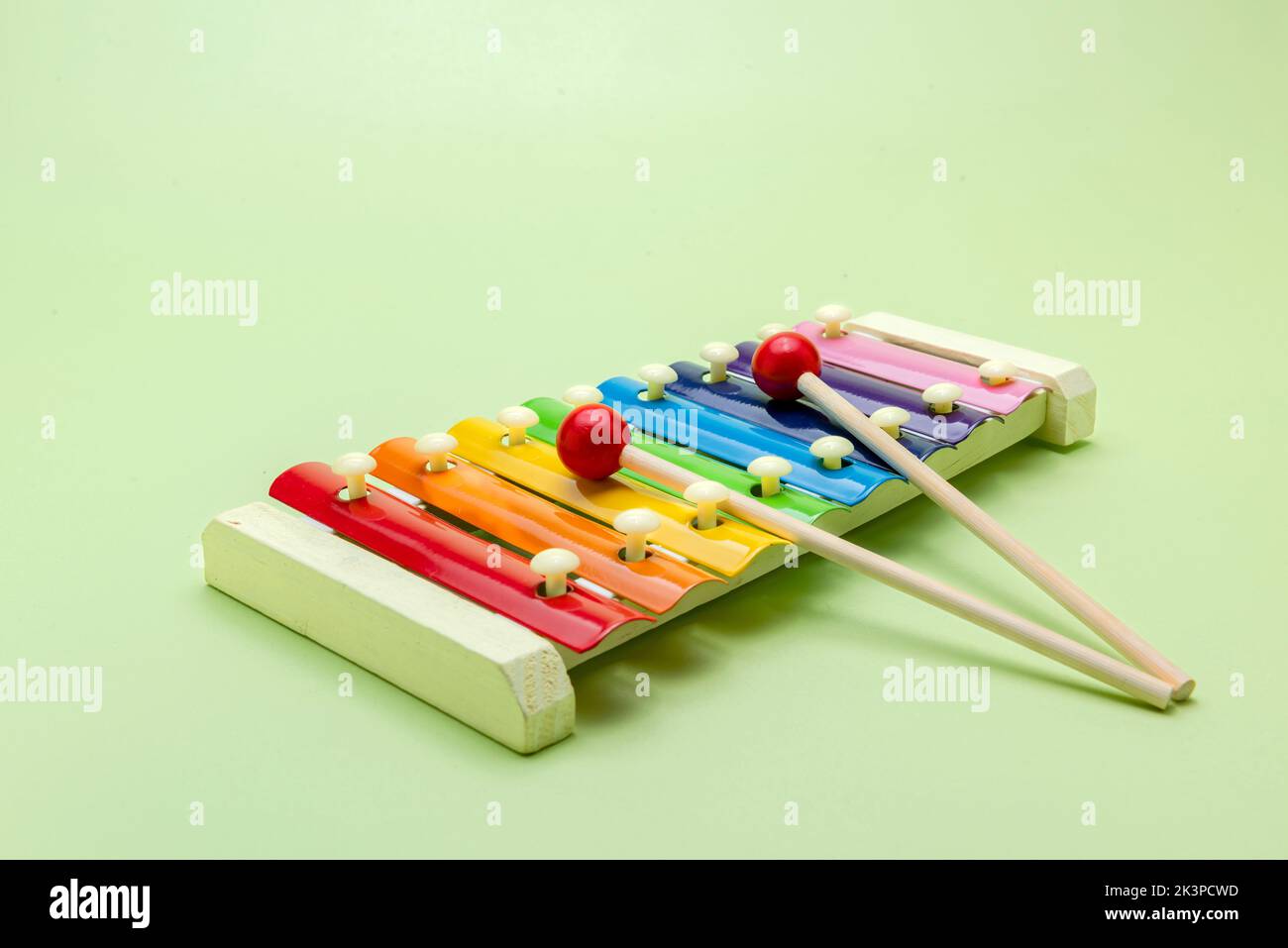 Colorful wooden xylophone toy on a colored background Stock Photo