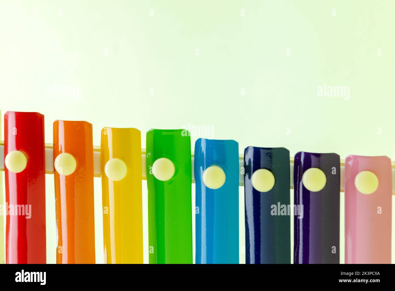 Colorful wooden xylophone toy on a colored background Stock Photo