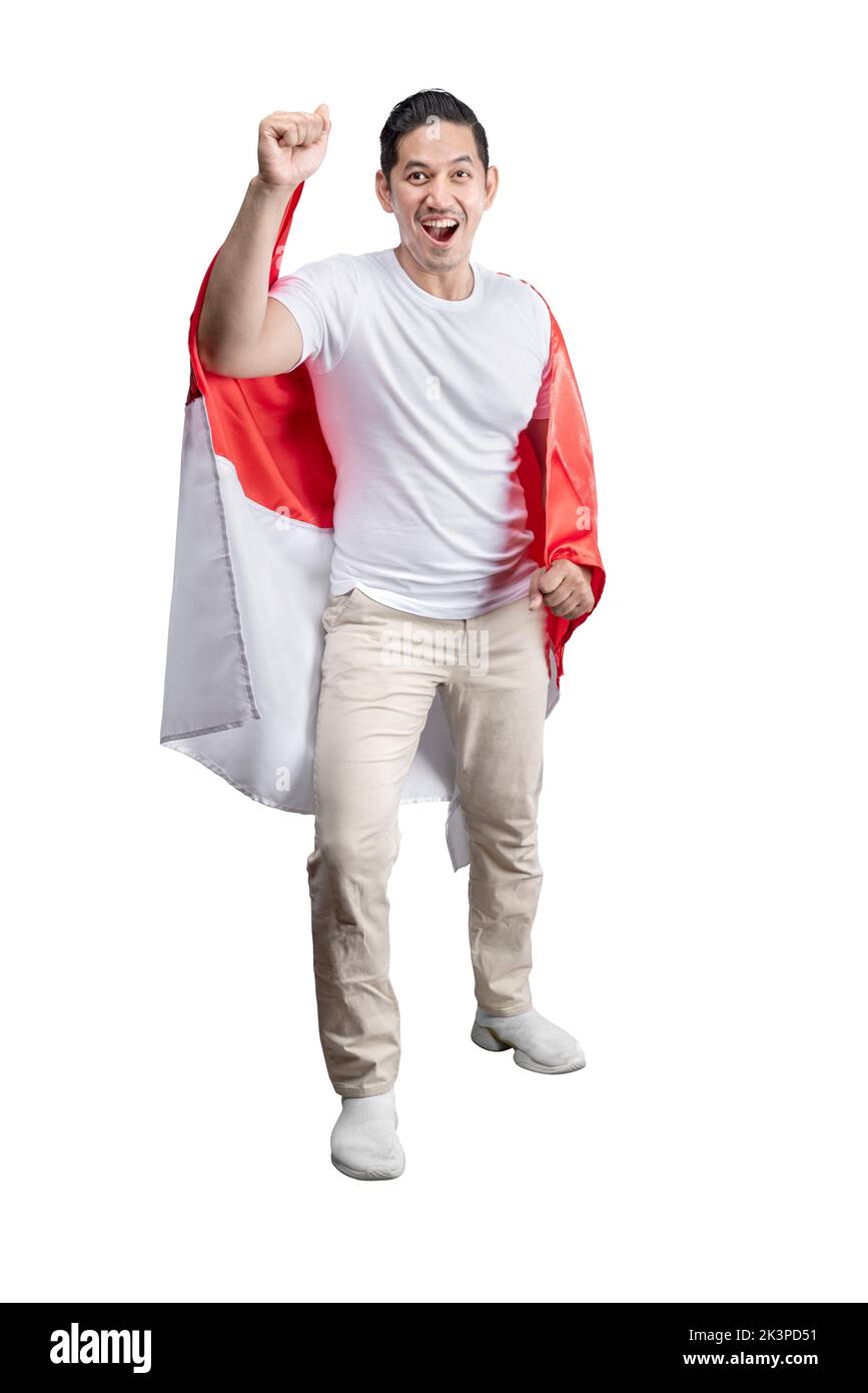 Indonesian men celebrate Indonesian independence day on 17 August by holding the Indonesian flag isolated over white background Stock Photo