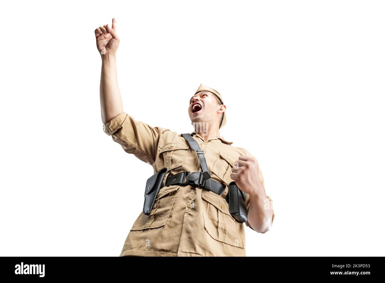 Indonesian warrior standing with excited expression isolated over white background Stock Photo