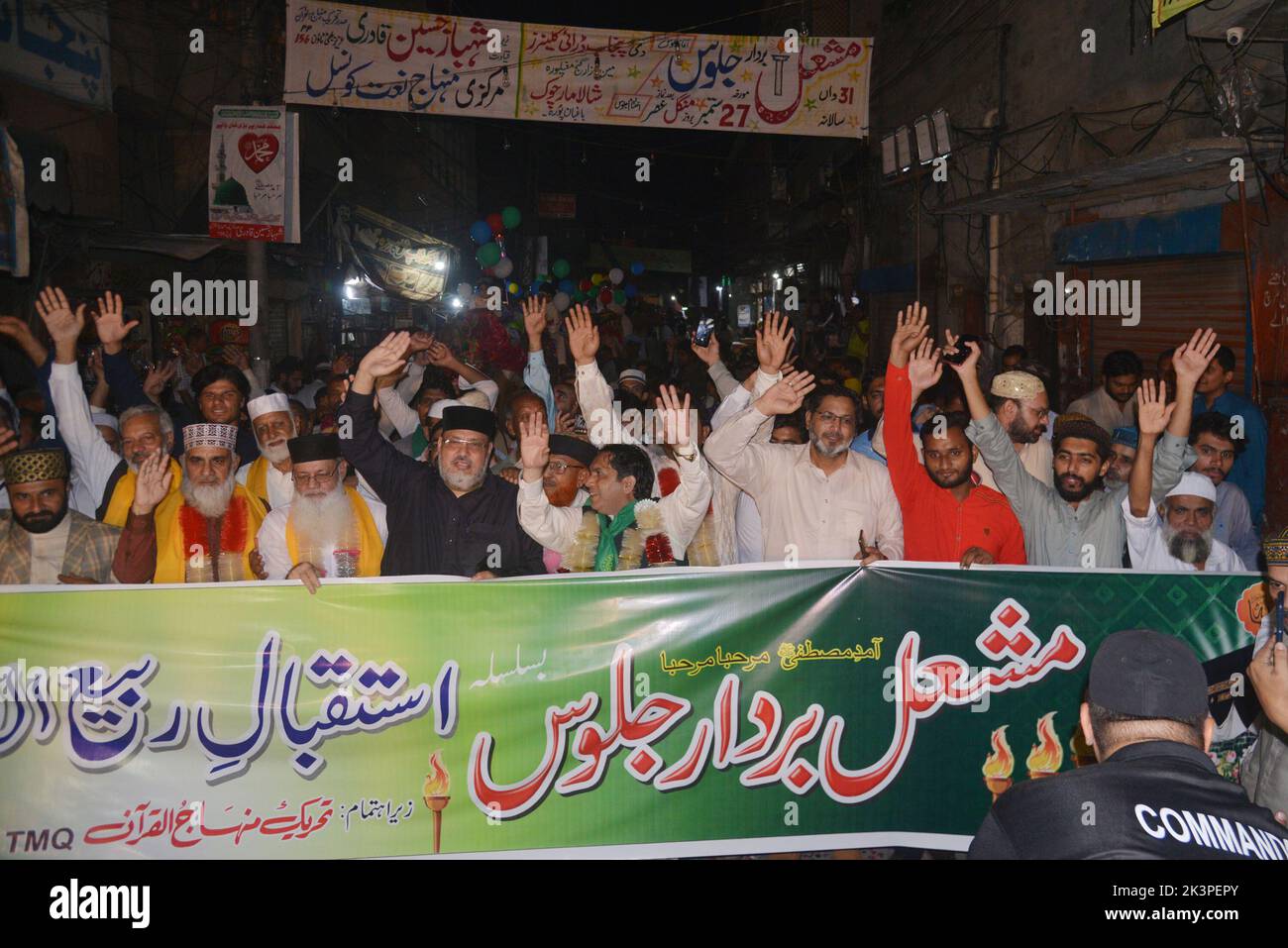 Lahore, Punjab, Pakistan. 27th Sep, 2022. Pakistani faithful Muslims from a religious group Tehreek Minhaj Ul-Quran (PAT) attending a torch rally to welcome the month of Rabi Ul Awwal in connection with celebrations of Eid Milad-un-Nabi organized by Tehreek Minhaj Ul Quran Aziz Bhatti town in Lahore. President Shahbaz Hussain Qadri, Hammad Qadri, Subhani Qadri, and others lead the torch rally. (Credit Image: © Rana Sajid Hussain/Pacific Press via ZUMA Press Wire) Stock Photo