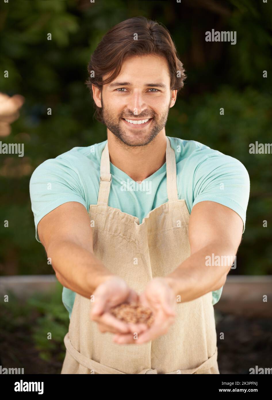 Seeds for next years garden. Portrait of a handsome young garden
