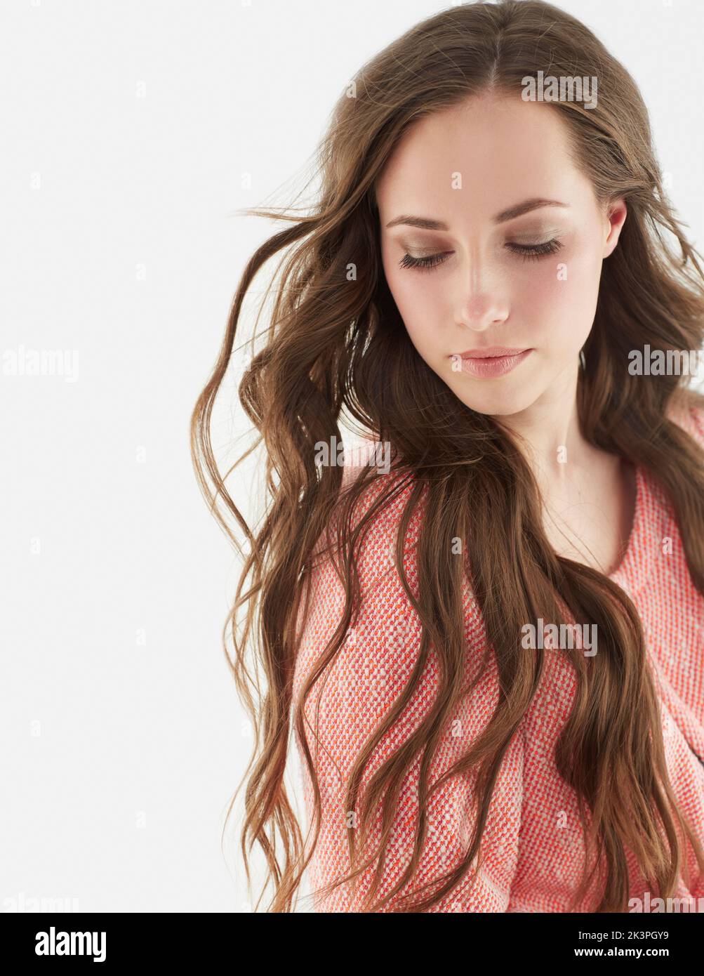 Thinking of past times. Studio portrait of an attractive young woman. Stock Photo