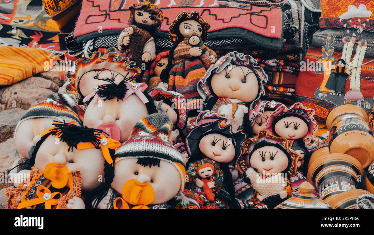 A closeup shot of traditional sewn dolls for souvenirs in Cusco, Peru Stock Photo