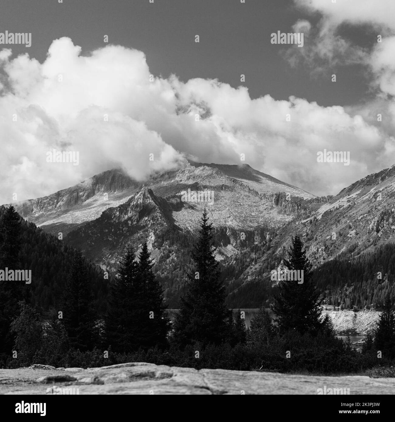 A black and white shot of a rocky mountain Val di Fumo in Trentino, Italy Stock Photo