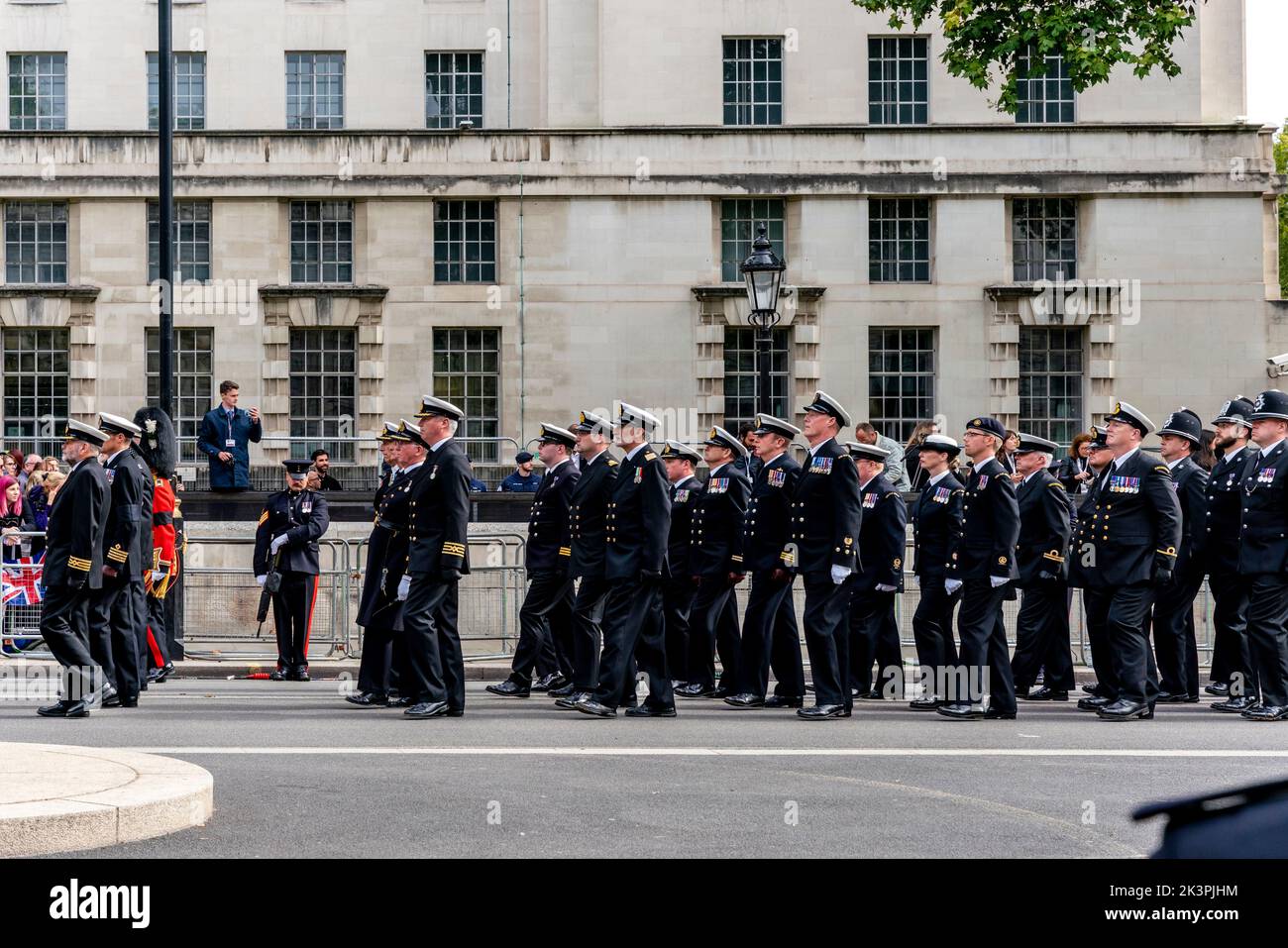 Representatives Of The Civilian Services Walk Behind The Coffin Of Queen Elizabeth II As The Funeral Procession Travels Up Whitehall, London, UK. Stock Photo