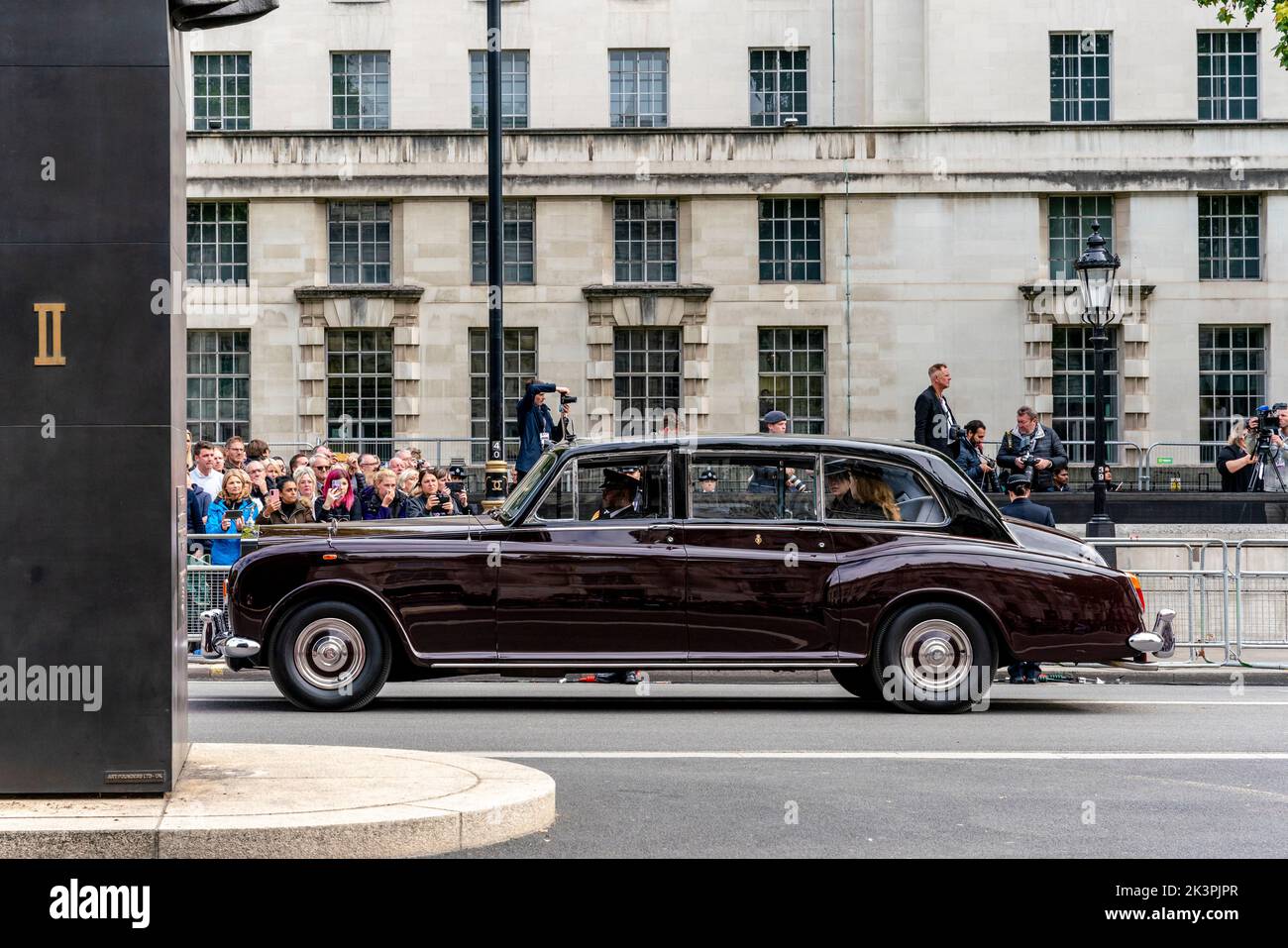 The Royal Car With Princess Beatrice and Princess Eugenie Follows The Coffin Of Queen Elizabeth II As The Funeral Procession Travels Up Whitehall Stock Photo