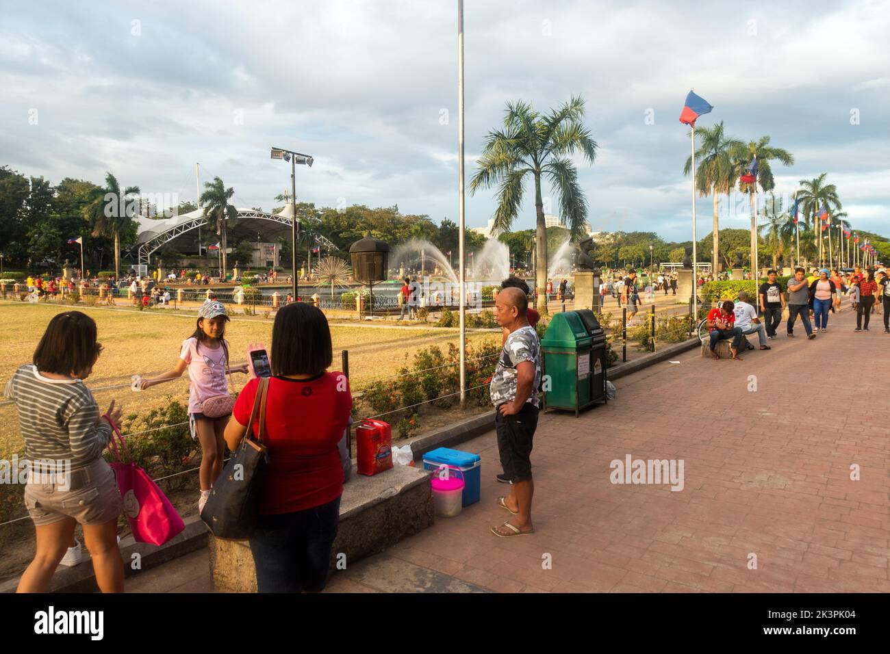 Manila, Philippines - People enjoying a sunny day at Rizal Park Stock Photo