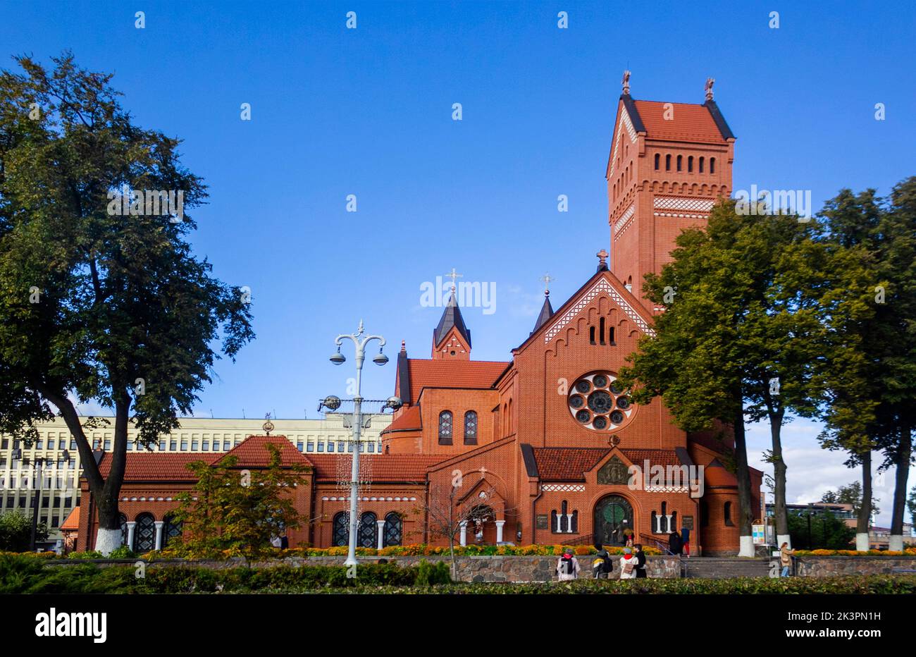 Panoramic view of the famous Catholic Church of St. Simon and Helena, the Red Church, on Independence Square. Belarus .24.09.2022 Minsk, Belarus Stock Photo