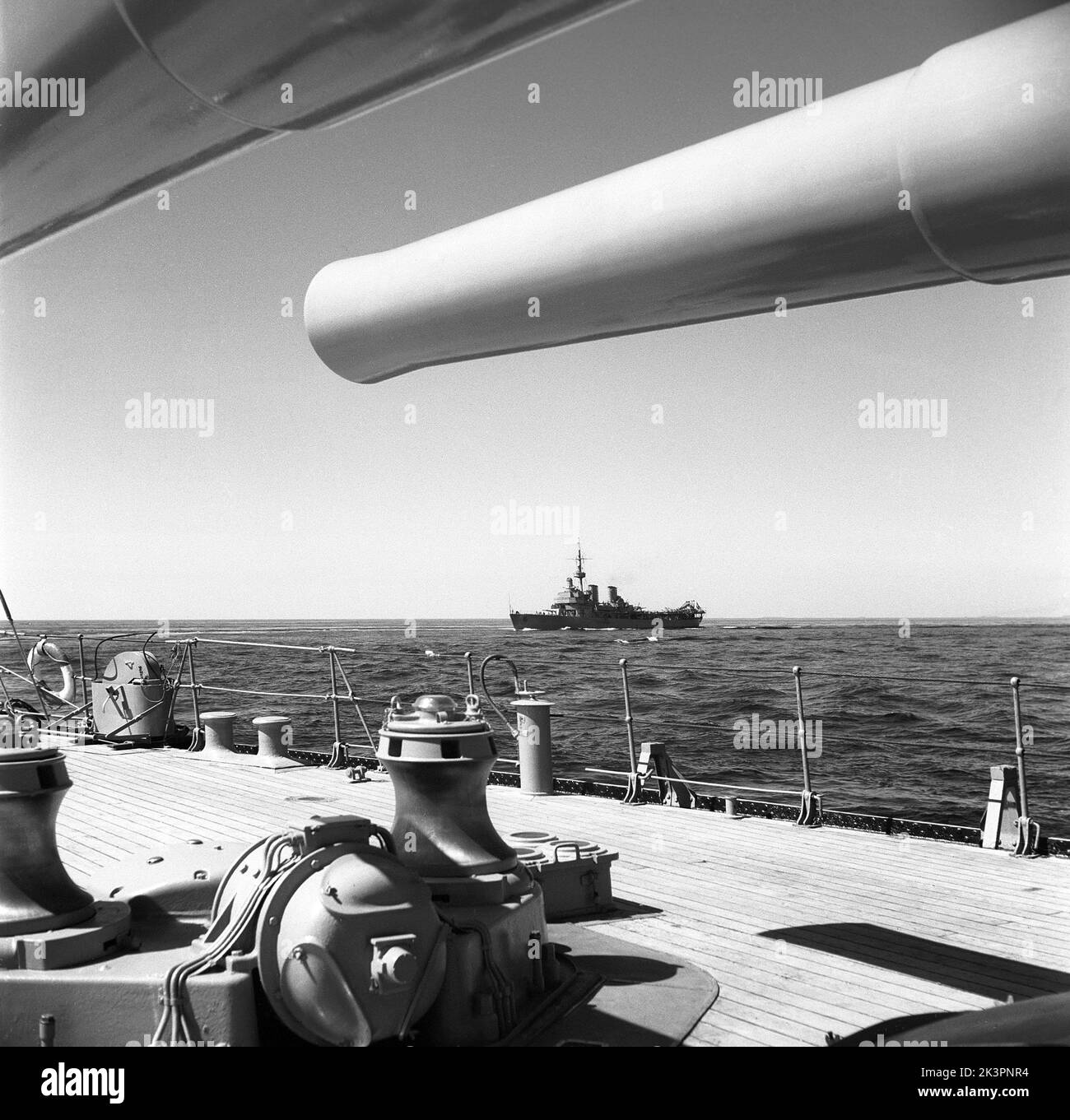 During World war II. The war ship Sverige during navy exercises at sea. The front cannons are visible with a swedish warships cruising on the side. Sweden june 1940. Kristoffersson ref 141 Stock Photo