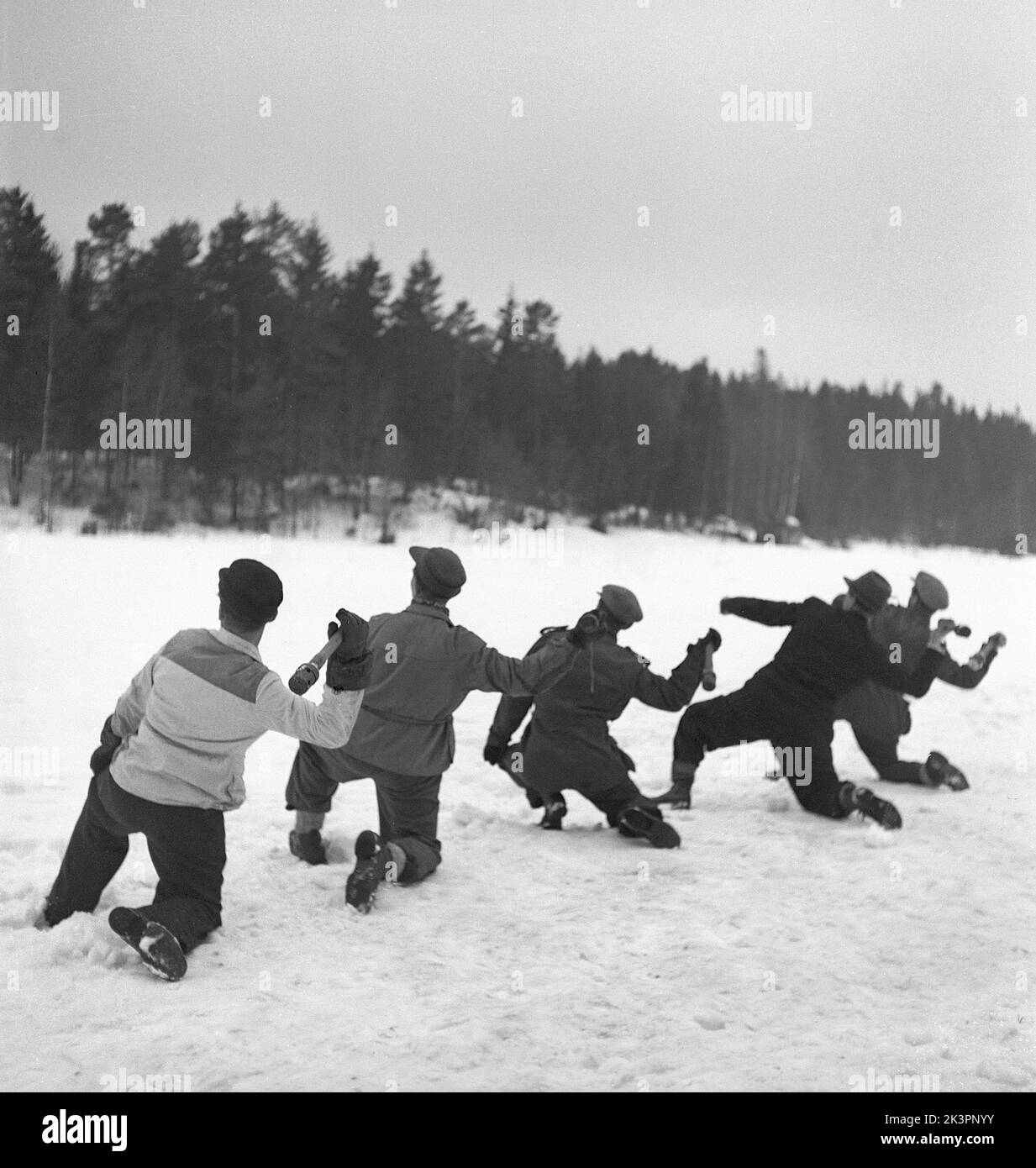 Sweden during World War II. A group of men is practising how to throw a grenade. The swedish men often took part in military training arranged by the government. Sweden 1942 Kristoffersson ref M138-6 Stock Photo