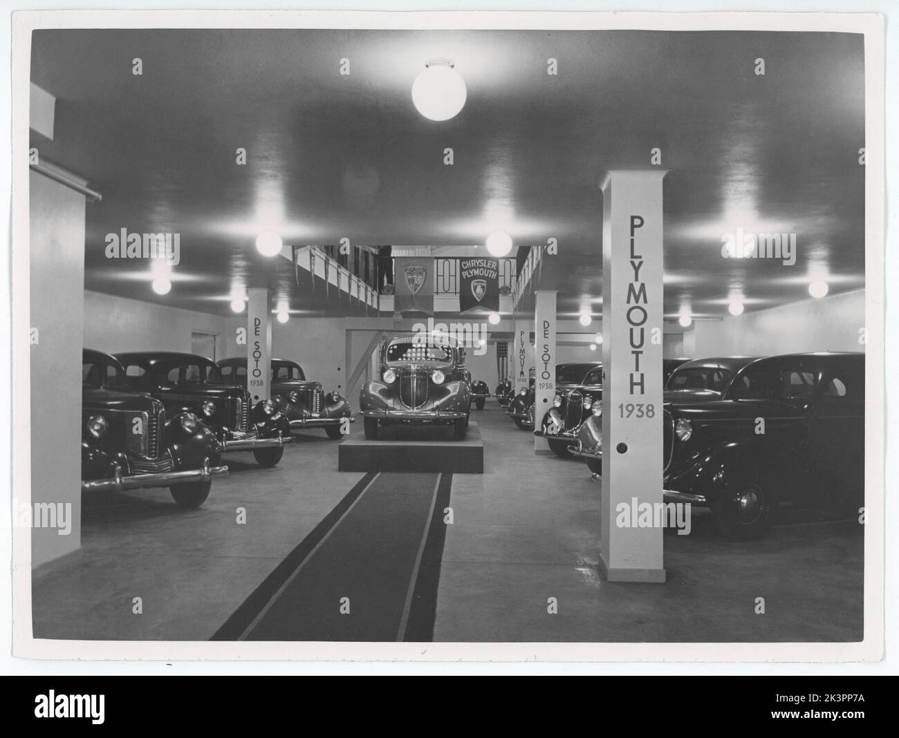 1930s new cars for sale. The swedish representative for General Motors have the brand new car models on display in their showroom. Plymouth, Chystler and De Soto. Sweden 1938 Stock Photo