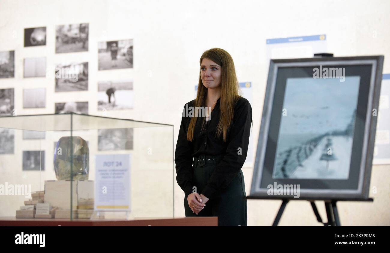 KYIV, UKRAINE - SEPTEMBER 27, 2022 - A woman reacts during the WHERE ARE YOU? charity auction at the Ukrainian House held in celebration of Mariupol C Stock Photo
