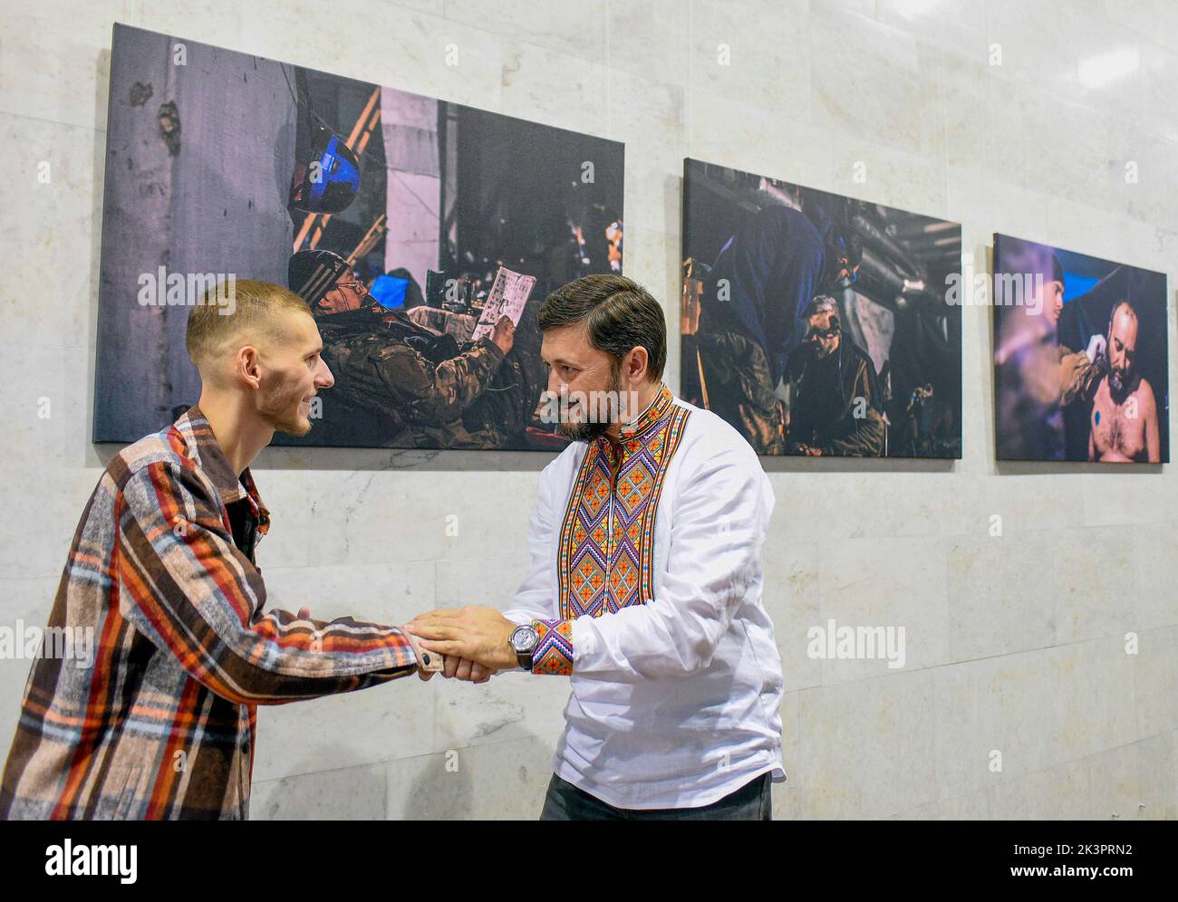 KYIV, UKRAINE - SEPTEMBER 27, 2022 - Mariupol city head Vadym Boichenko (R) shakes hands with Azov Regiment press officer, photographer Dmytro Kozatsk Stock Photo