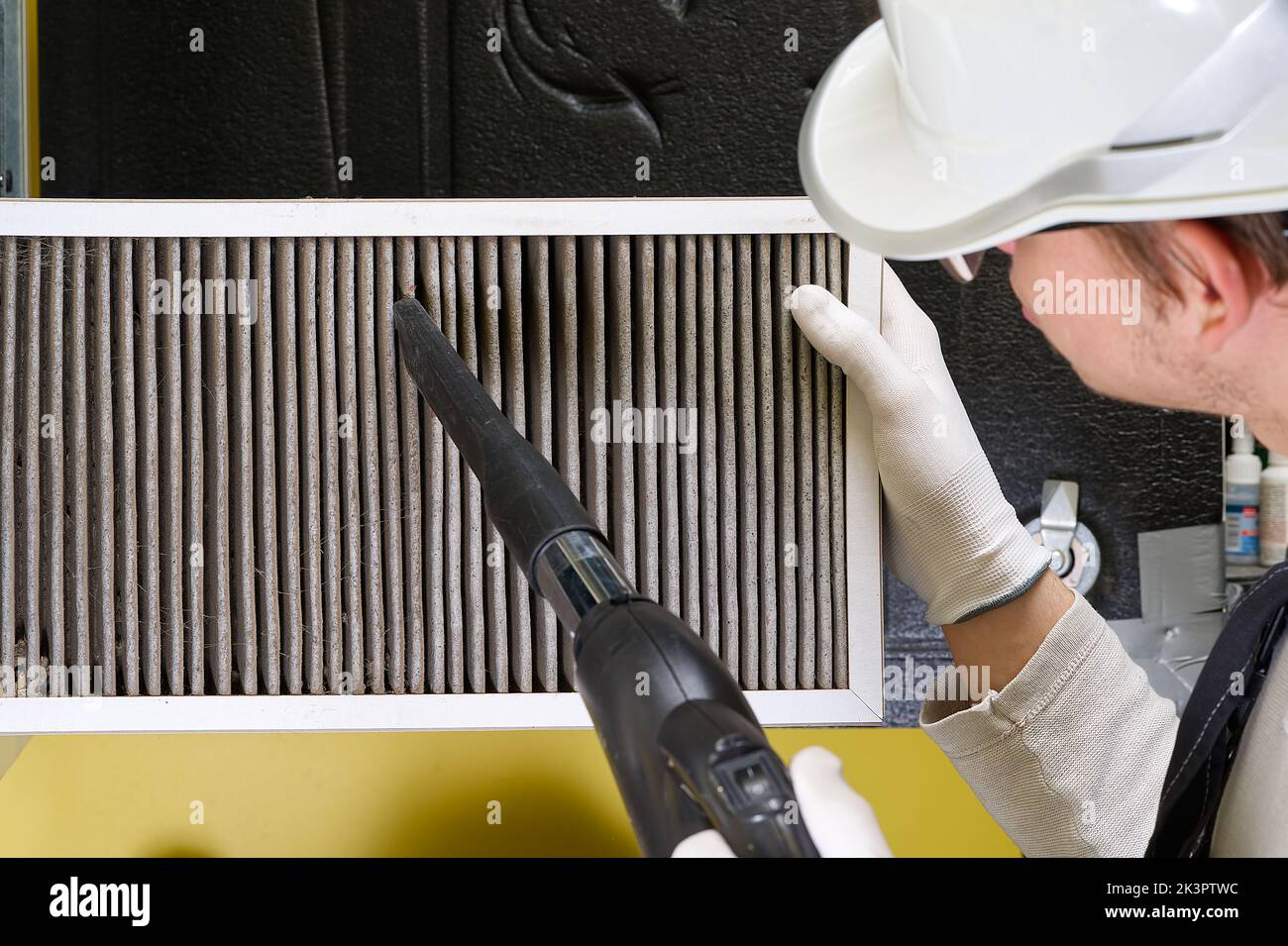 Replacing filter in the central ventilation system. hvac filter replacing home central air system Stock Photo