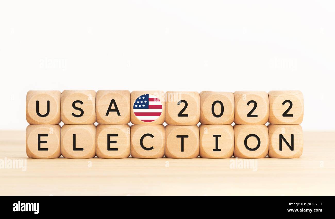 USA 2022 presidential election concept. Wooden block with text and american flag icon. Copy space Stock Photo