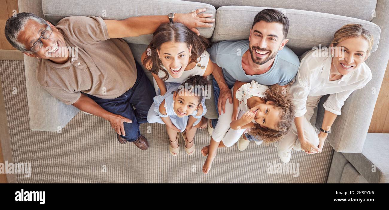 Children, parents and grandparents on sofa with above view and generations of family spending time together. Love, diversity and couple with girl kids Stock Photo