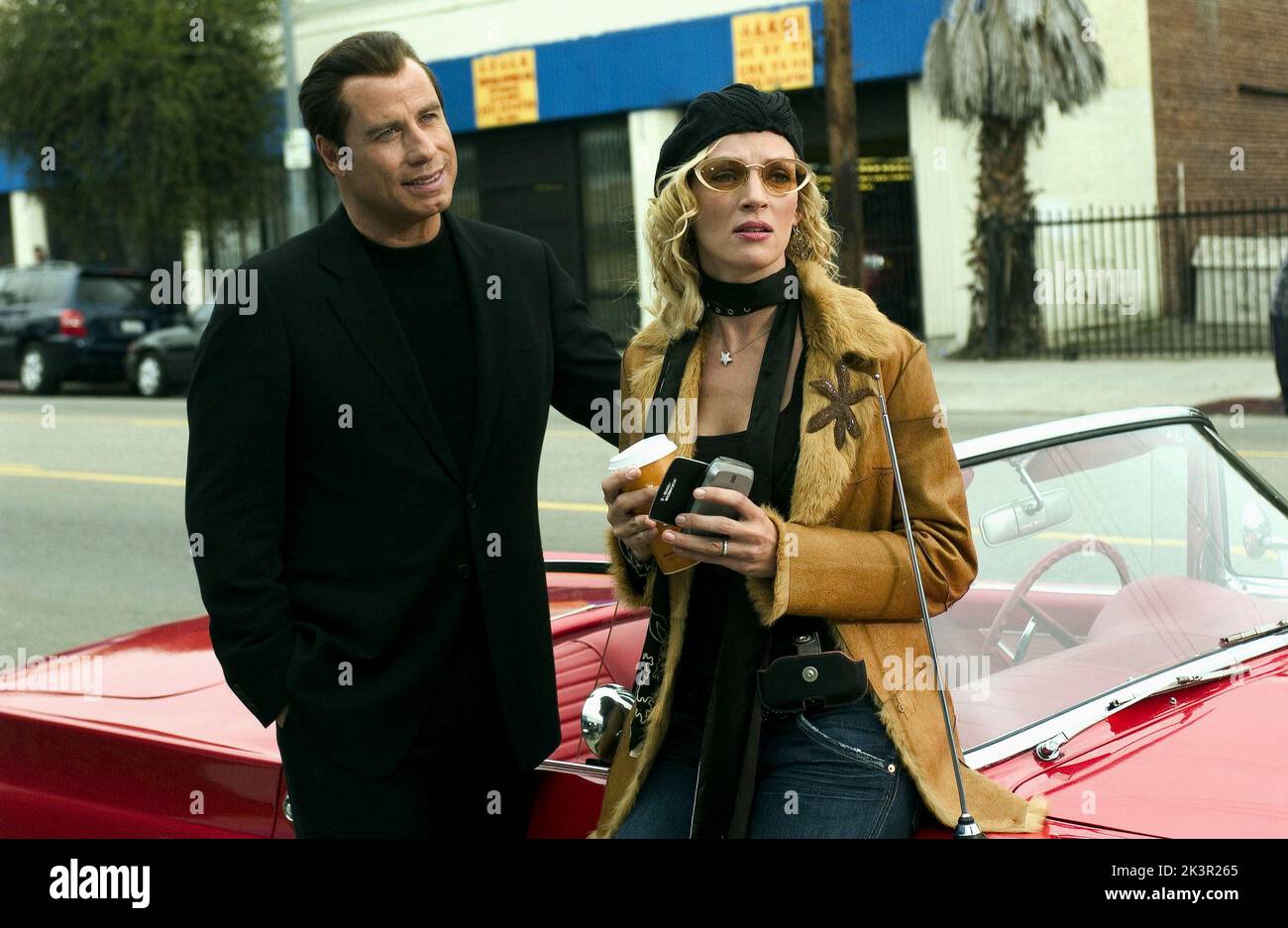 John Travolta & Uma Thurman Film: Be Cool (USA 2005) Characters: Chili Palmer & Edie Athens  Director: F. Gary Gray 04 March 2005   **WARNING** This Photograph is for editorial use only and is the copyright of MGM and/or the Photographer assigned by the Film or Production Company and can only be reproduced by publications in conjunction with the promotion of the above Film. A Mandatory Credit To MGM is required. The Photographer should also be credited when known. No commercial use can be granted without written authority from the Film Company. Stock Photo