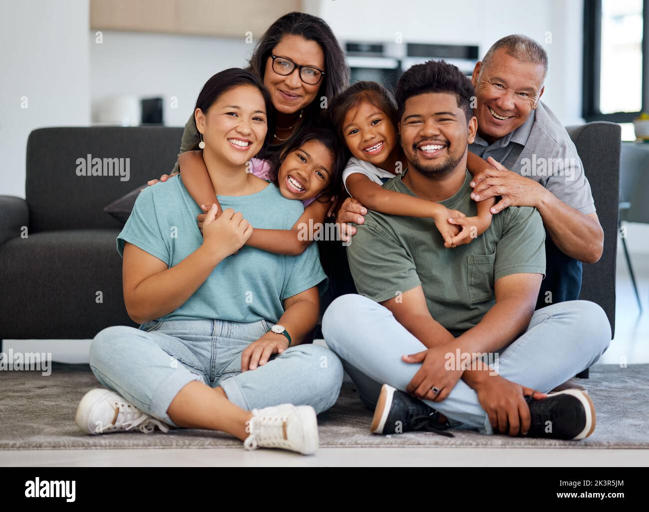 Big family portrait, children with grandparents with love, hug and smile together. Happy elderly mother, father and kids bonding together with adult Stock Photo