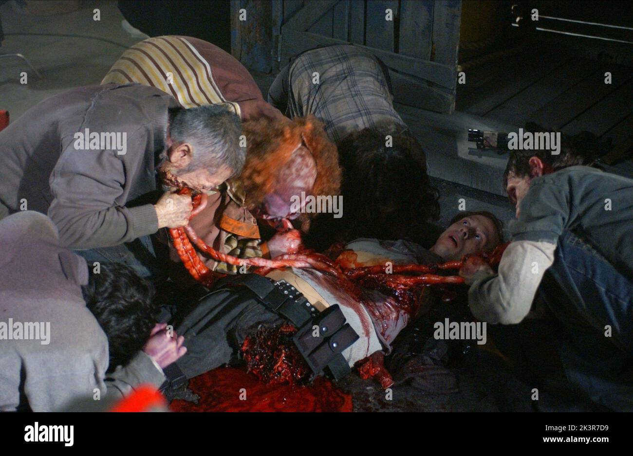 Zombies Eat Man Entrails Film: Land Of The Dead (USA/CAN/FR 2005)   Director: George A. Romero 18 June 2005   **WARNING** This Photograph is for editorial use only and is the copyright of UNIVERSAL PICTURES and/or the Photographer assigned by the Film or Production Company and can only be reproduced by publications in conjunction with the promotion of the above Film. A Mandatory Credit To UNIVERSAL PICTURES is required. The Photographer should also be credited when known. No commercial use can be granted without written authority from the Film Company. Stock Photo