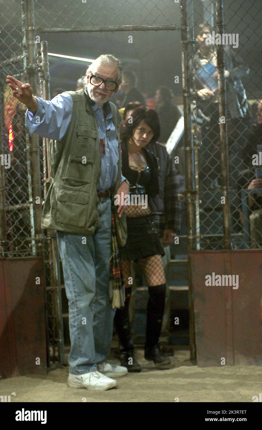 George A. Romero & Asia Argento Film: Land Of The Dead (USA/CAN/FR 2005) Characters: Puppeteer (voice) (uncredited) & Slack  Director: George A. Romero 18 June 2005   **WARNING** This Photograph is for editorial use only and is the copyright of UNIVERSAL PICTURES and/or the Photographer assigned by the Film or Production Company and can only be reproduced by publications in conjunction with the promotion of the above Film. A Mandatory Credit To UNIVERSAL PICTURES is required. The Photographer should also be credited when known. No commercial use can be granted without written authority from th Stock Photo