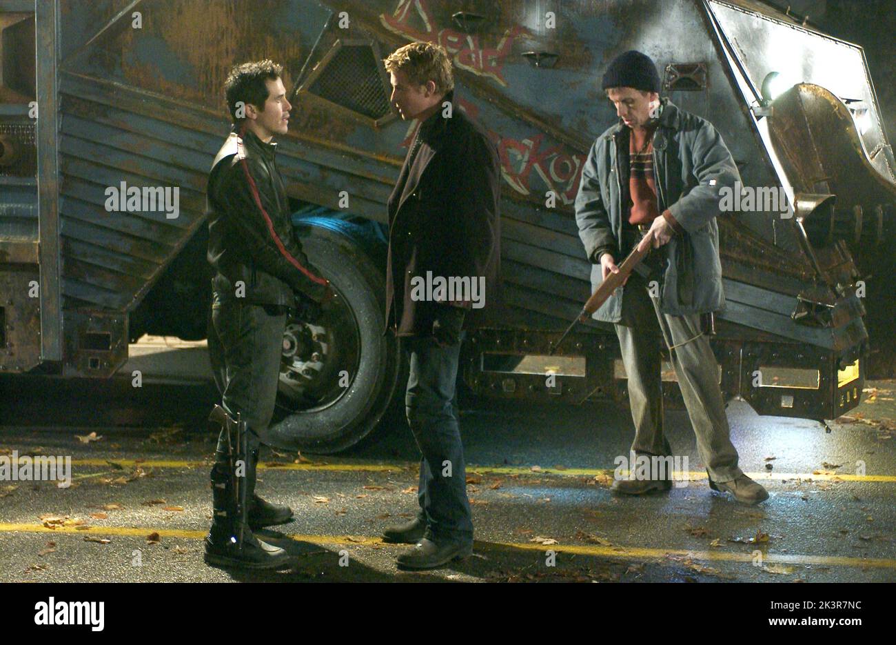 John Leguizamo, Simon Baker & Robert Joy Film: Land Of The Dead (USA/CAN/FR 2005) Characters: Cholo,Riley & Charlie  Director: George A. Romero 18 June 2005   **WARNING** This Photograph is for editorial use only and is the copyright of UNIVERSAL PICTURES and/or the Photographer assigned by the Film or Production Company and can only be reproduced by publications in conjunction with the promotion of the above Film. A Mandatory Credit To UNIVERSAL PICTURES is required. The Photographer should also be credited when known. No commercial use can be granted without written authority from the Film C Stock Photo