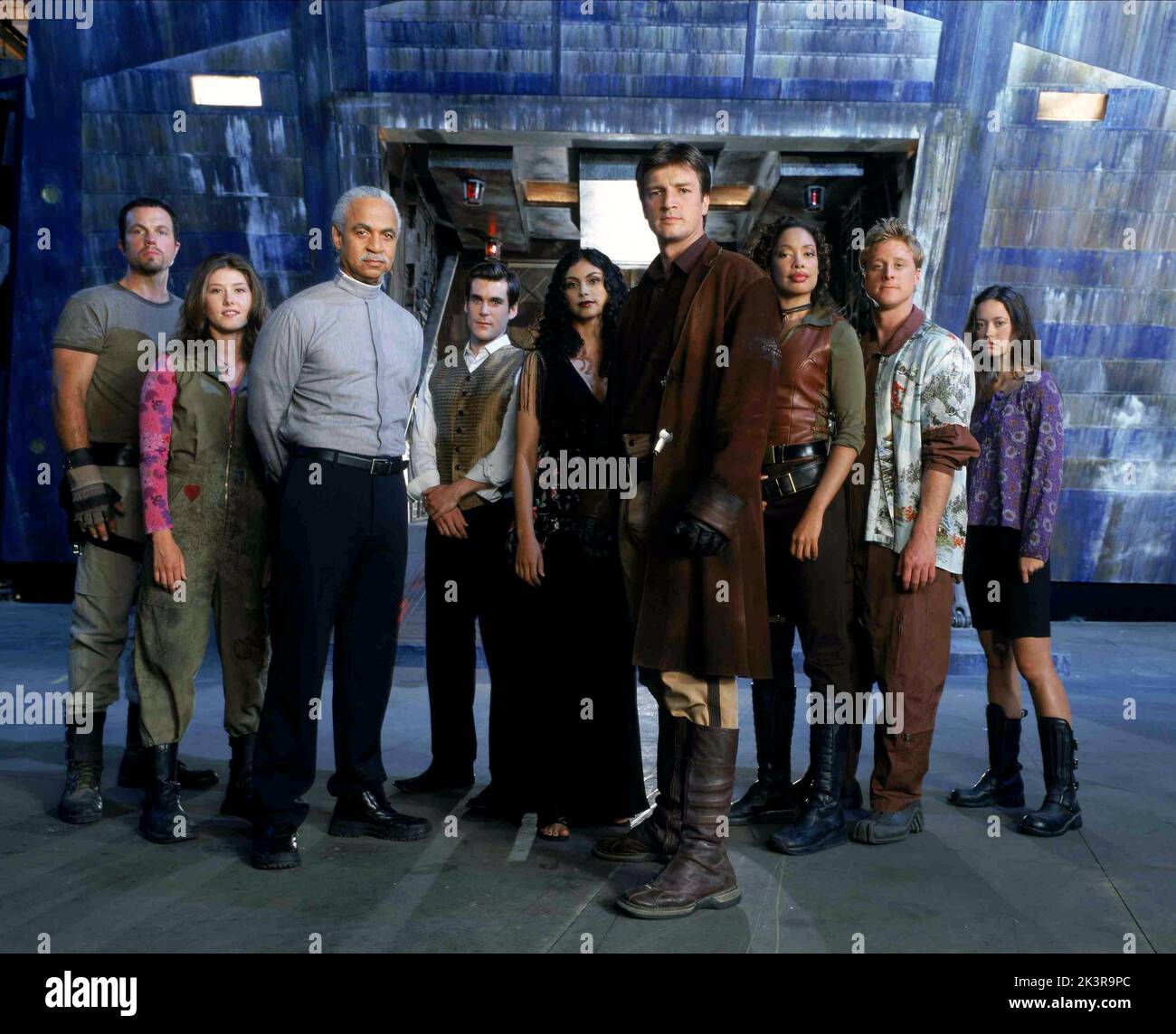 Adam Baldwin, Jewel Staite, Ron Glass, Sean Maher, Morena Baccarin, Nathan Fillion, Gina Torres, Alan Tudyk & Summer Glau Film: Serenity (USA 2005) Characters: Jayne, Kaylee, Shepherd Book, Simon, Inara, Mal, Zoe, Wash, River  Director: Joss Whedon 22 September 2005   **WARNING** This Photograph is for editorial use only and is the copyright of UNIVERSAL PICTURES and/or the Photographer assigned by the Film or Production Company and can only be reproduced by publications in conjunction with the promotion of the above Film. A Mandatory Credit To UNIVERSAL PICTURES is required. The Photographer Stock Photo