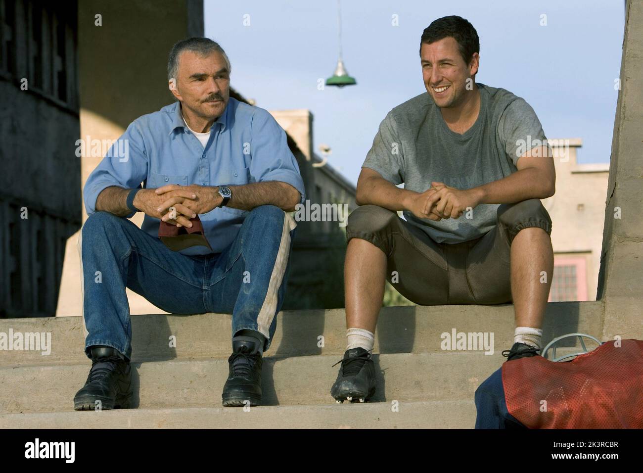 Burt Reynolds & Adam Sandler Film: The Longest Yard (USA 2005) Characters: Coach Nate Scarborough & Paul Crewe  Director: Peter Segal 19 May 2005   **WARNING** This Photograph is for editorial use only and is the copyright of COLUMBIA PICTURES and/or the Photographer assigned by the Film or Production Company and can only be reproduced by publications in conjunction with the promotion of the above Film. A Mandatory Credit To COLUMBIA PICTURES is required. The Photographer should also be credited when known. No commercial use can be granted without written authority from the Film Company. Stock Photo