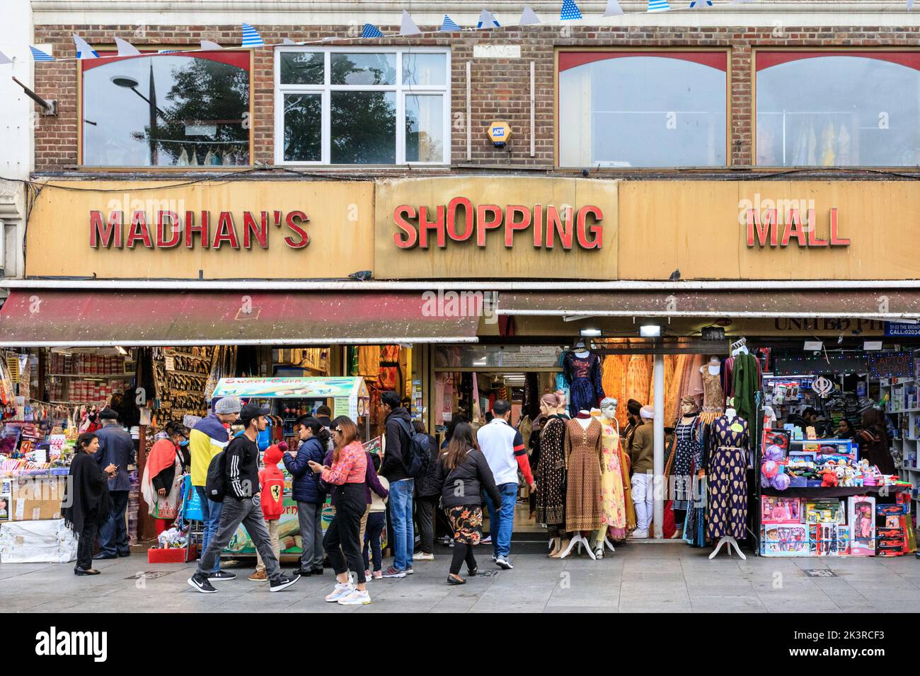 Madhan's Shopping Mall, Punjabi, Indian and Asian shops and people shopping in Southall High Street, Southall, West London, England, UK Stock Photo