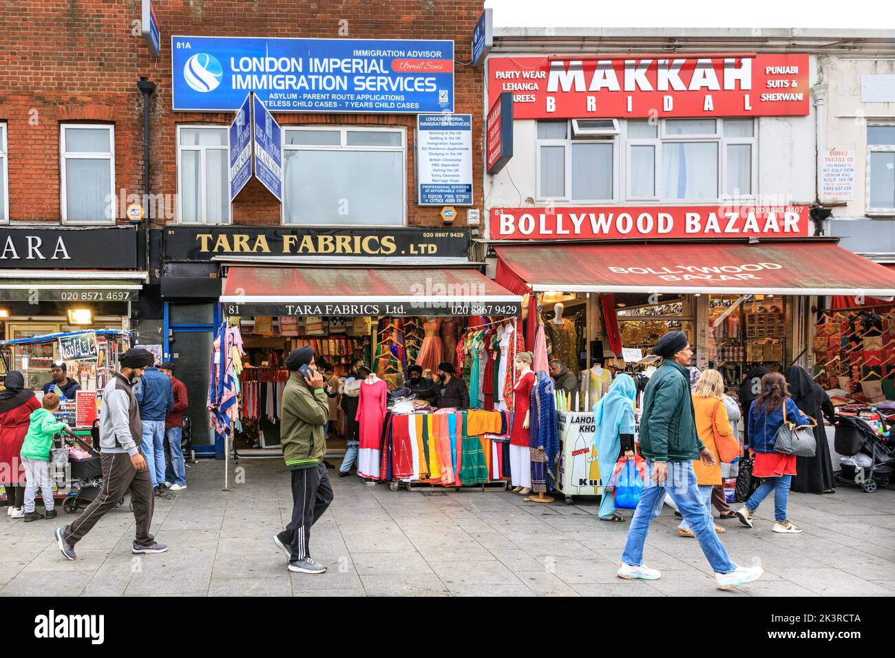 Punjabi, Indian and Asian shops and people shopping in Southall High Street, Southall, West London, England, UK Stock Photo