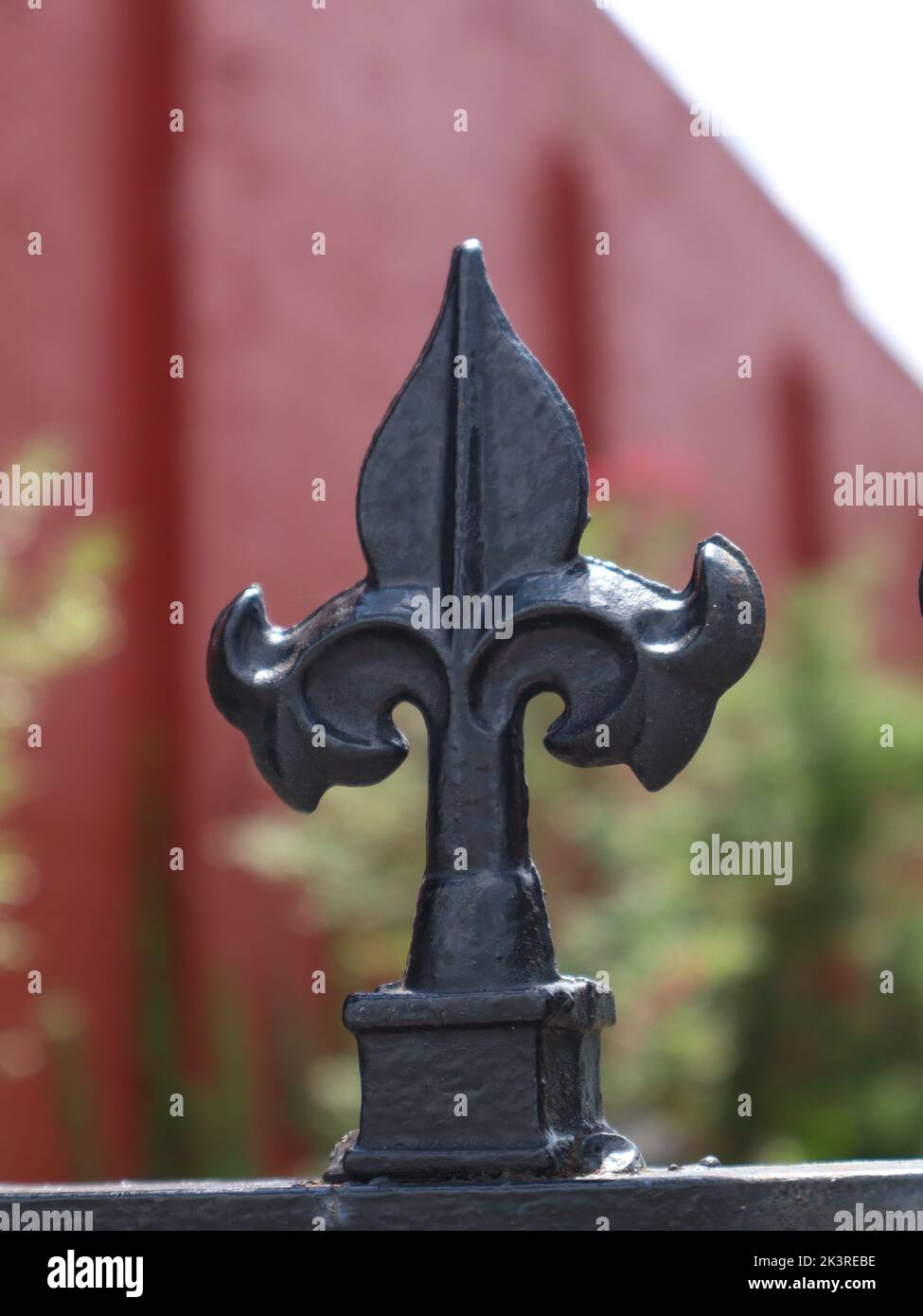 A vertical closeup of the top of a black metal fence Stock Photo - Alamy