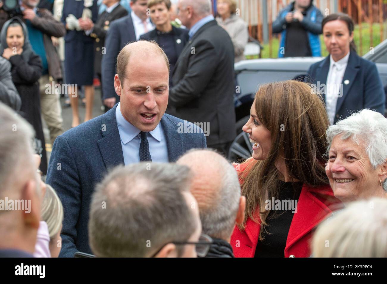 Prince William and Catherine Princess of Wales chatting with local people during their visit to Swansea this afternoon. The royal pair visited St Thomas church in Swansea which supports people in the local area and across Swansea. The church is home to a foodbank that supports over 200 people per week and Swansea Baby Basics, which distribute essential items for vulnerable mothers, such as toiletries and clothes. Stock Photo