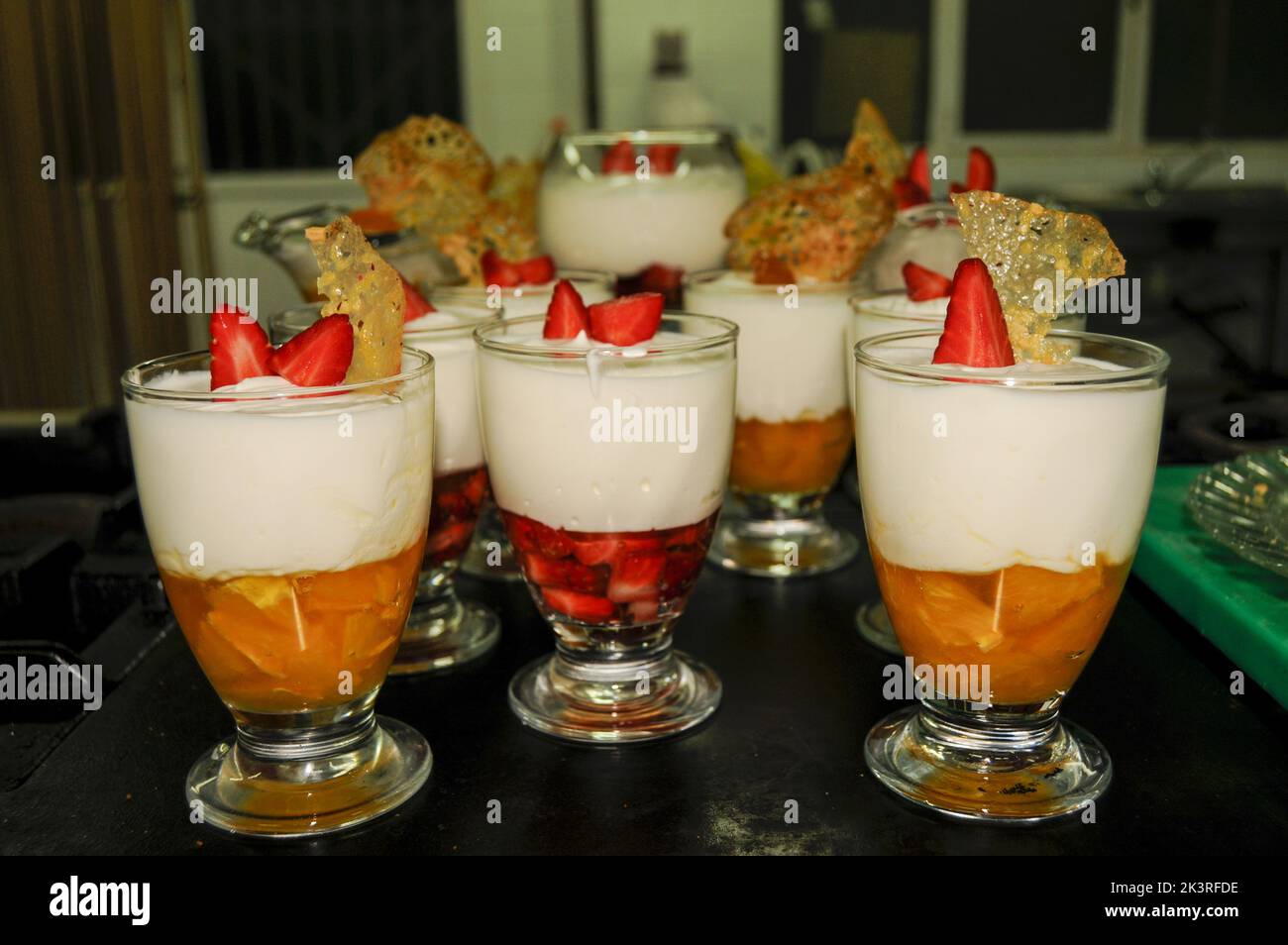 Yogurt and fruit mousse in glass cups Stock Photo