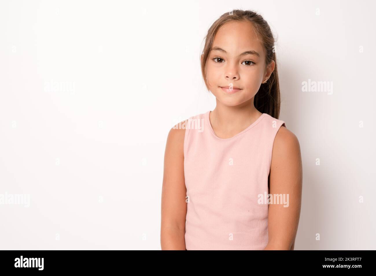 Portrait of young girl on white background Stock Photo - Alamy