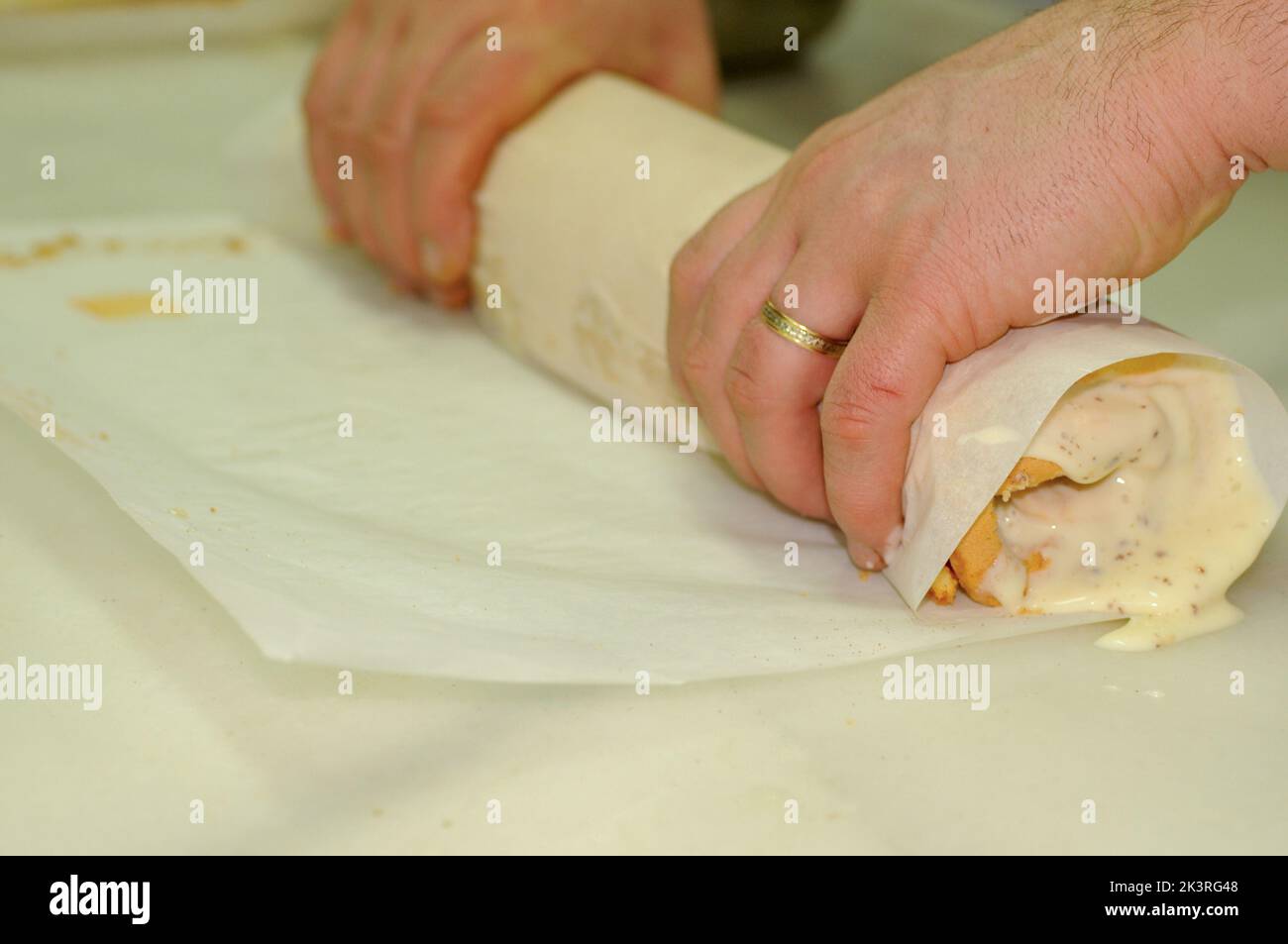 Hands rolled in a sweet rolled cream and meringue. Pioneer of santafe Stock Photo