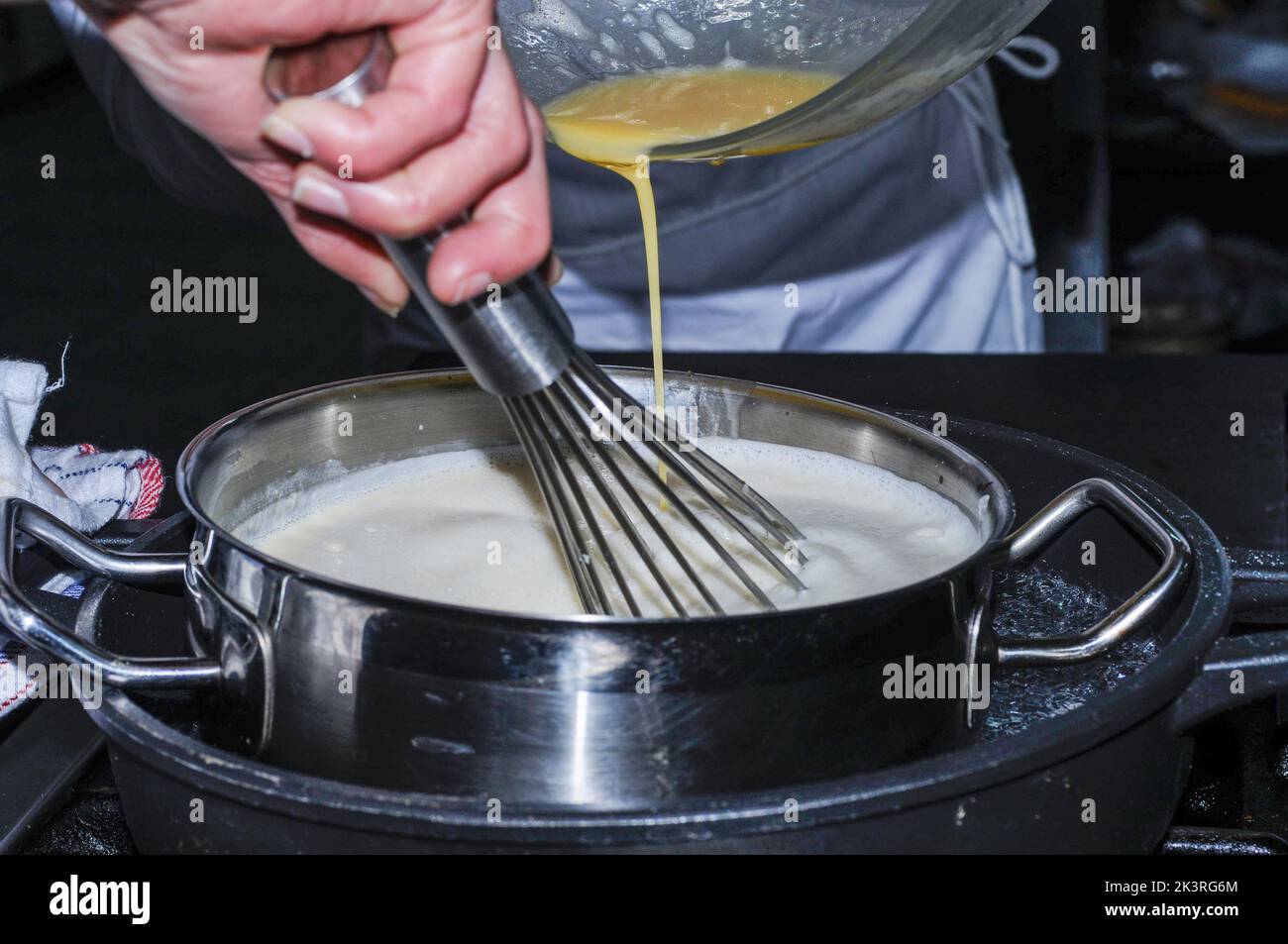 Chef preparing a flavored pastry cream Stock Photo