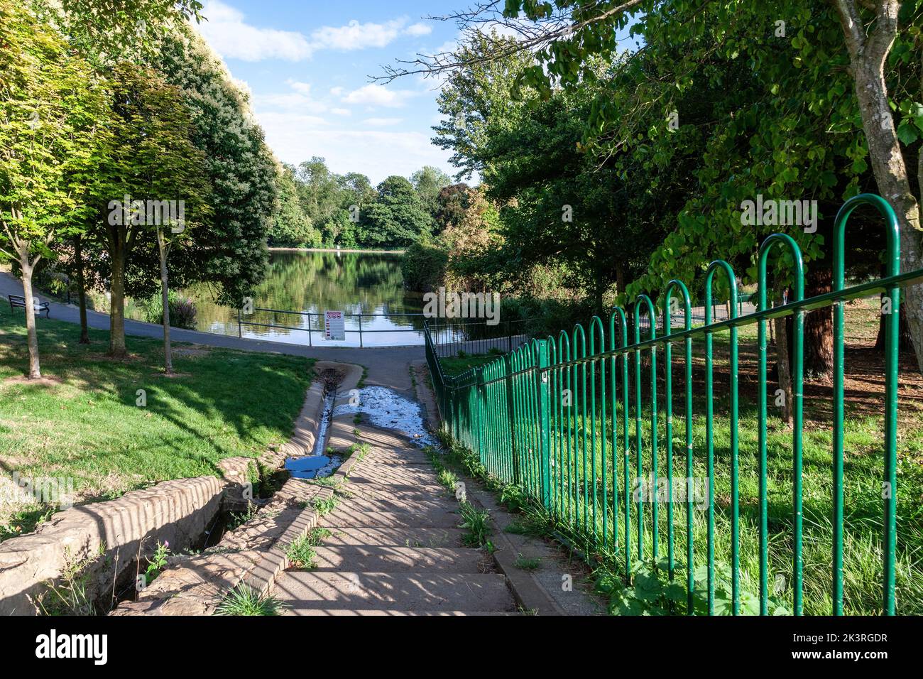 Water overflow from a boating lake into the main lake in Abington Park, Northampton, England, UK. Stock Photo