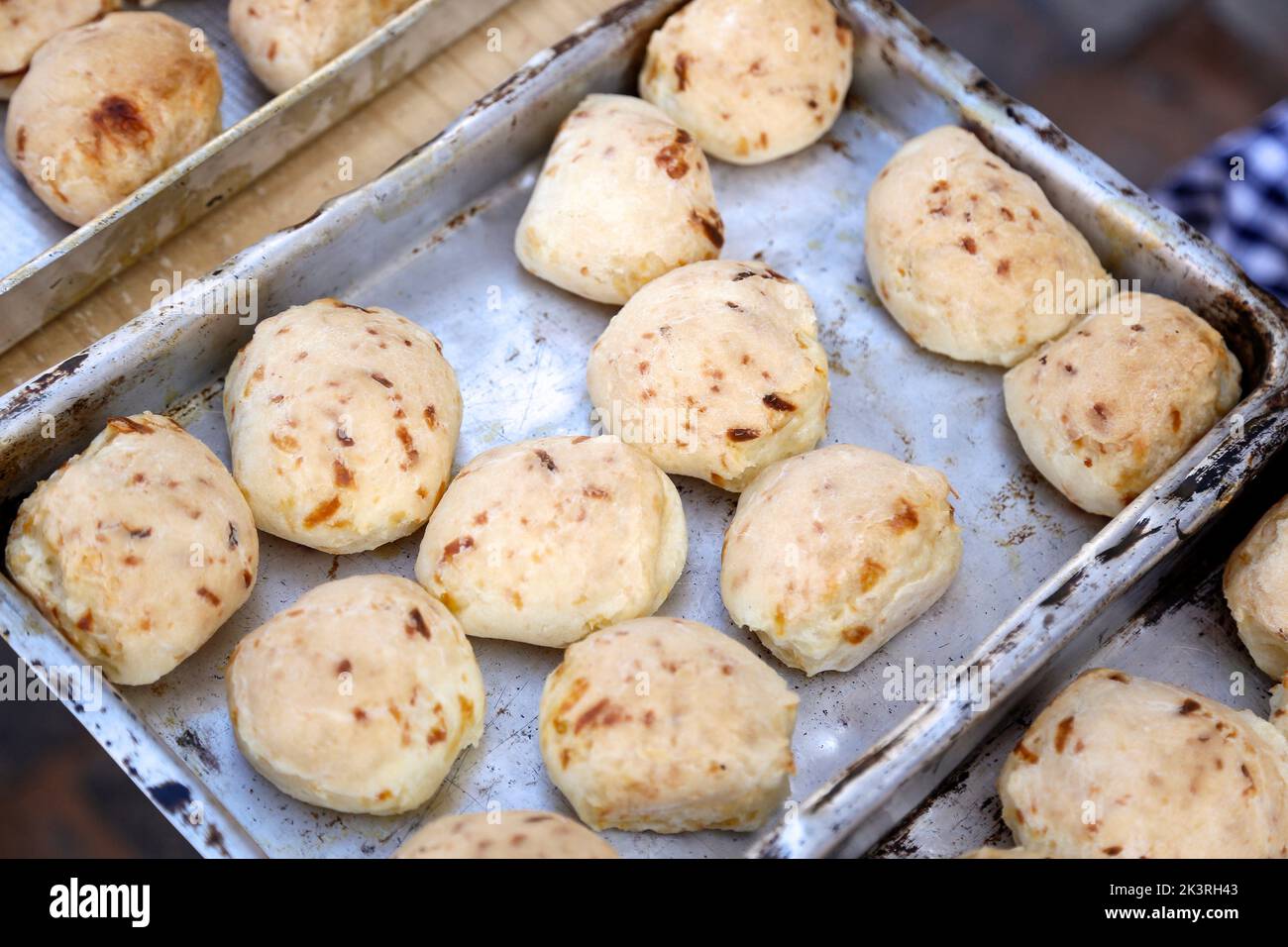 cheese bread and served in tin tray on table - brazilian food - selective focus Stock Photo