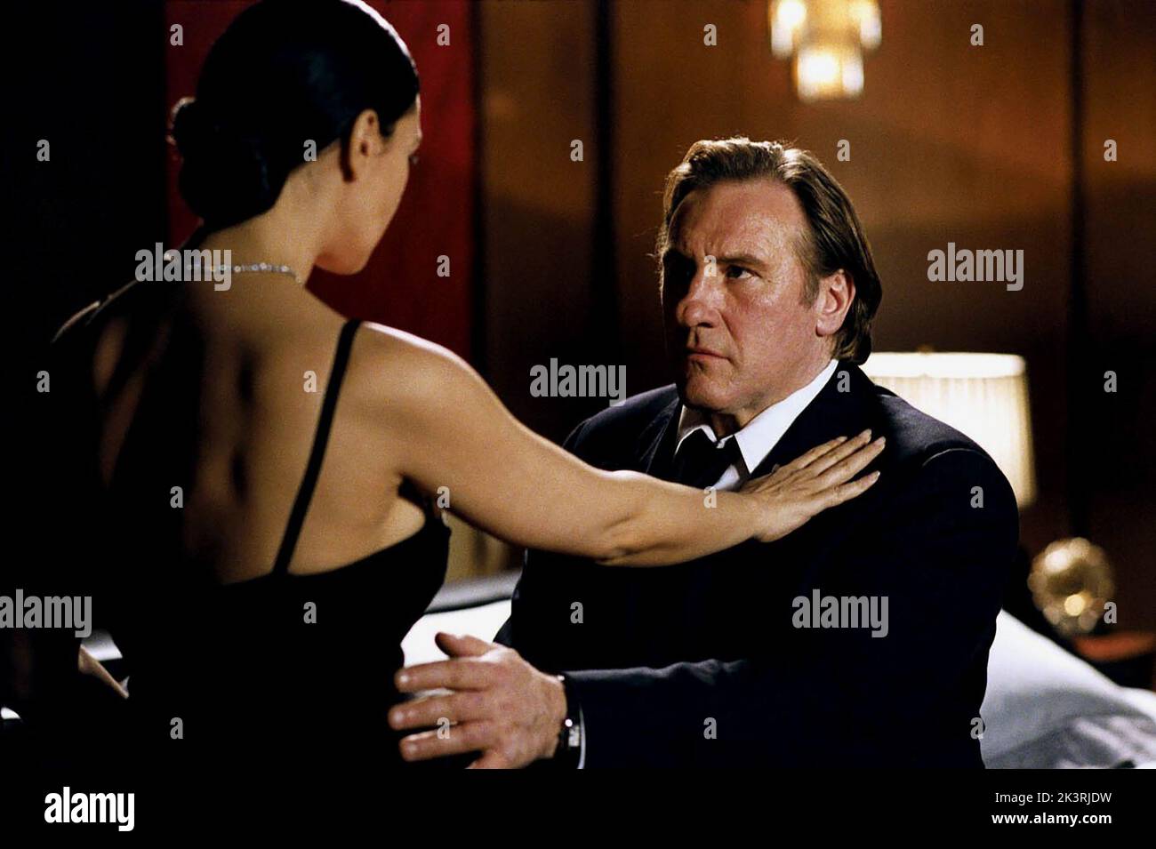 Monica Bellucci & Gerard Depardieu Film: Combien Tu M'Aimes? (2005) Characters: Daniela & Charly  Director: Bertrand Blier 26 October 2005   **WARNING** This Photograph is for editorial use only and is the copyright of TPS STAR and/or the Photographer assigned by the Film or Production Company and can only be reproduced by publications in conjunction with the promotion of the above Film. A Mandatory Credit To TPS STAR is required. The Photographer should also be credited when known. No commercial use can be granted without written authority from the Film Company. Stock Photo