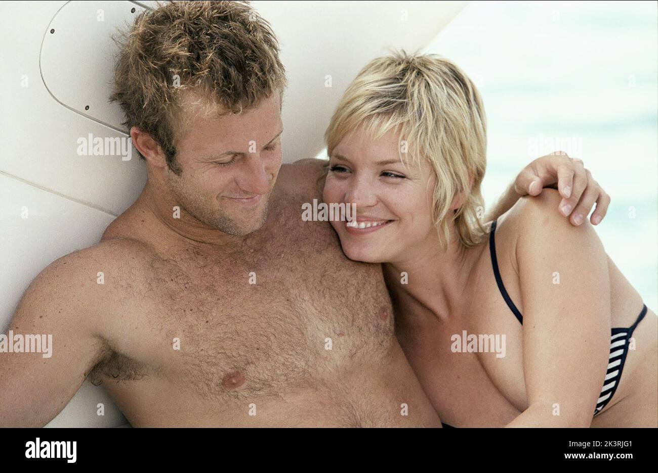 Scott Caan & Ashley Scott Film: Into The Blue (USA 2005) Characters: Bryce & Amanda  Director: John Stockwell 30 September 2005   **WARNING** This Photograph is for editorial use only and is the copyright of MGM and/or the Photographer assigned by the Film or Production Company and can only be reproduced by publications in conjunction with the promotion of the above Film. A Mandatory Credit To MGM is required. The Photographer should also be credited when known. No commercial use can be granted without written authority from the Film Company. Stock Photo