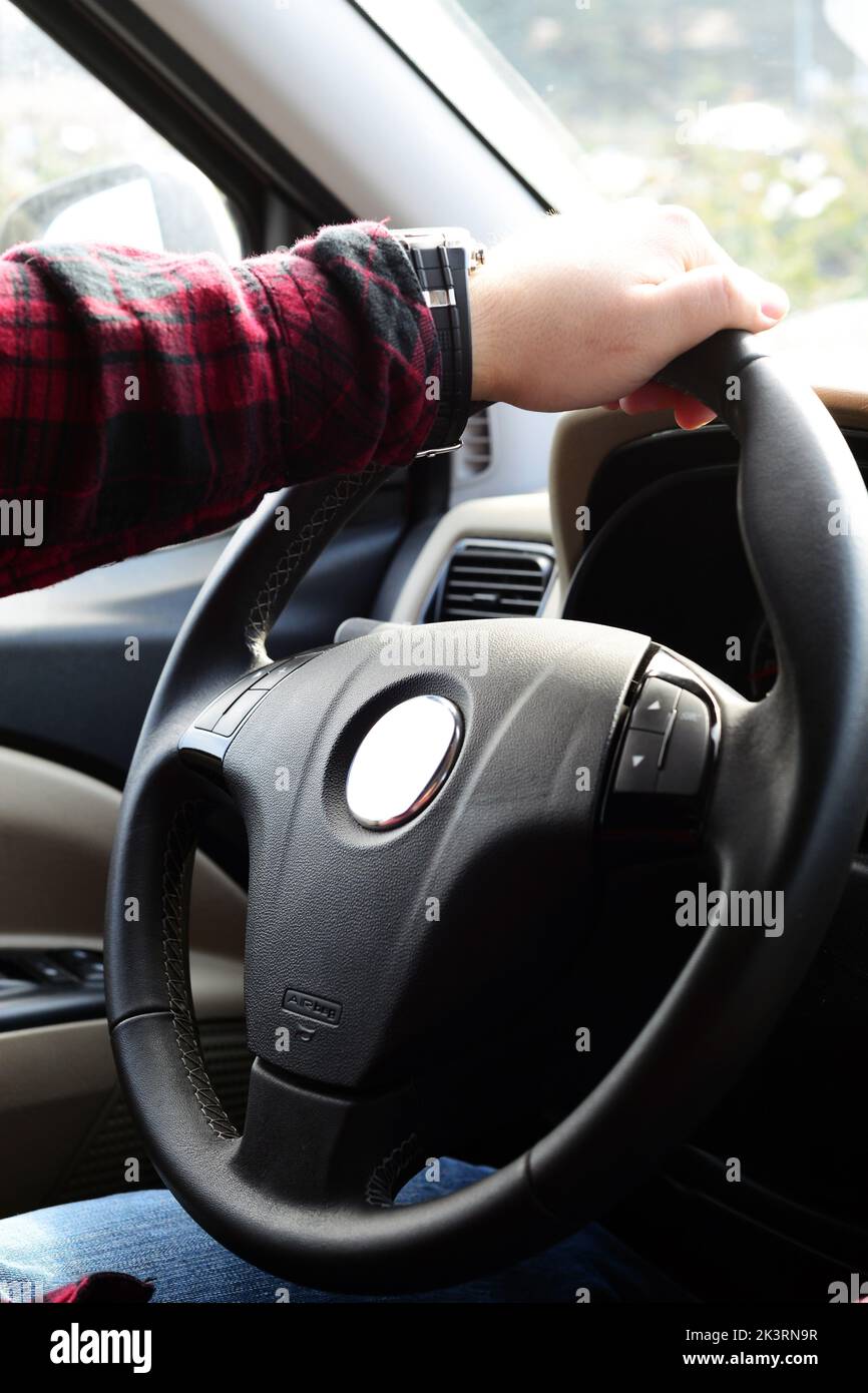 Hand holding steering wheel hi-res stock photography and images - Alamy
